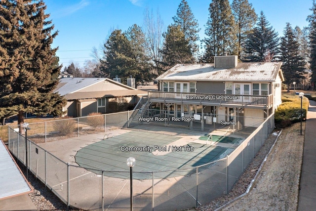 exterior space featuring a covered pool and a patio area