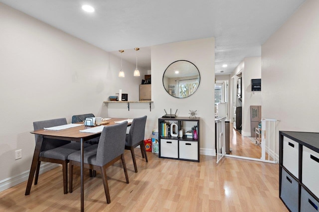 dining room with light wood-type flooring