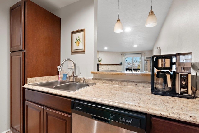 kitchen featuring sink, decorative light fixtures, and dishwasher