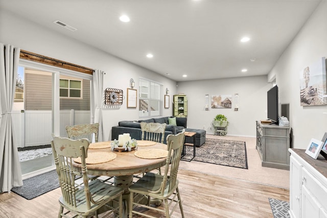dining space featuring light wood-type flooring, recessed lighting, and visible vents
