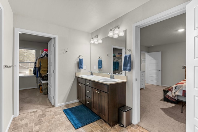 interior space with a spacious closet and baseboards