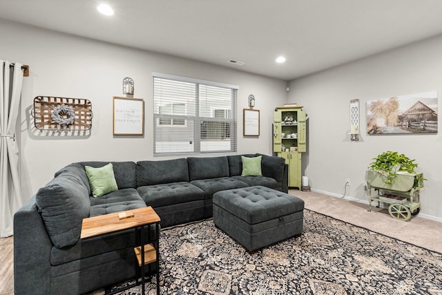 carpeted living area featuring stairway, baseboards, and recessed lighting