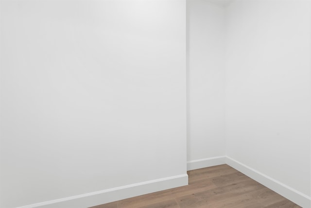 spare room with hardwood / wood-style flooring