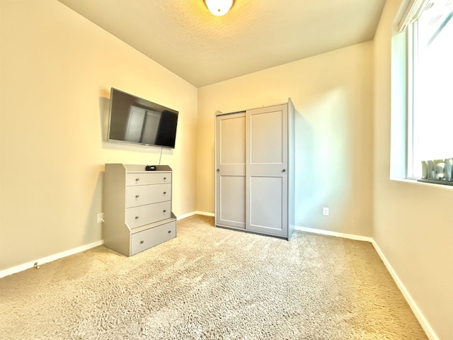 unfurnished bedroom featuring carpet flooring