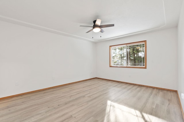 unfurnished room featuring ceiling fan and light wood-type flooring