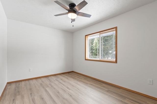 unfurnished room featuring a textured ceiling, ceiling fan, and light hardwood / wood-style flooring