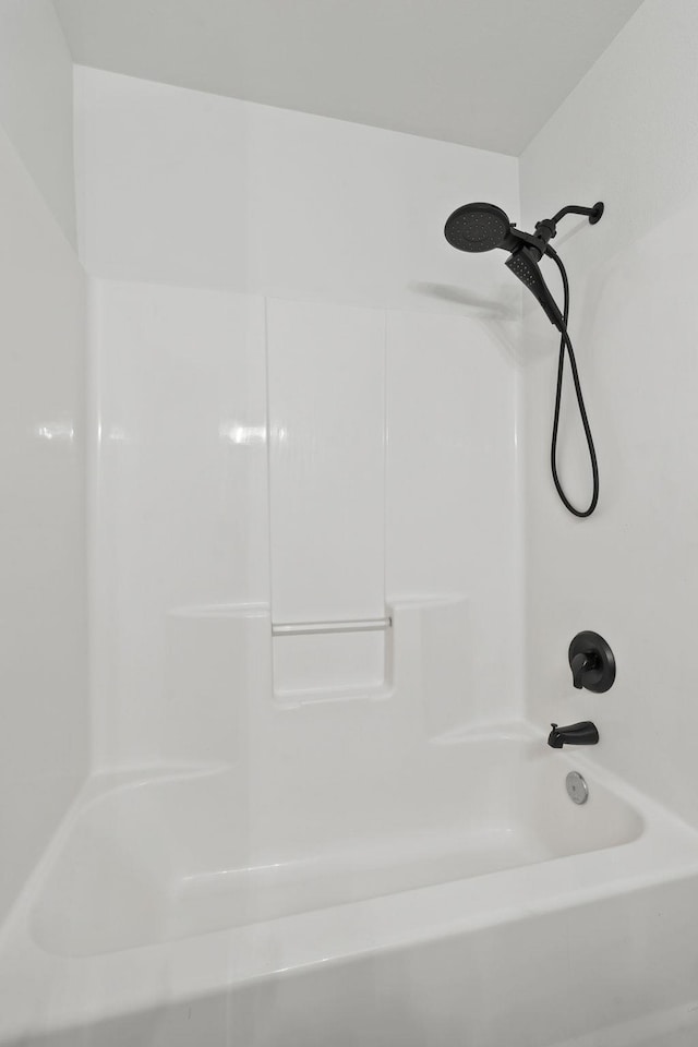 bathroom with shower / washtub combination