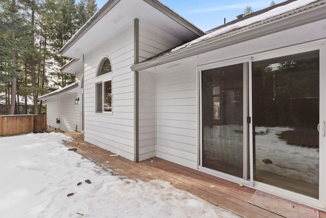 view of side of property featuring a wooden deck