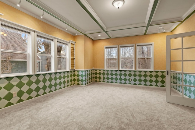 carpeted spare room featuring crown molding and coffered ceiling