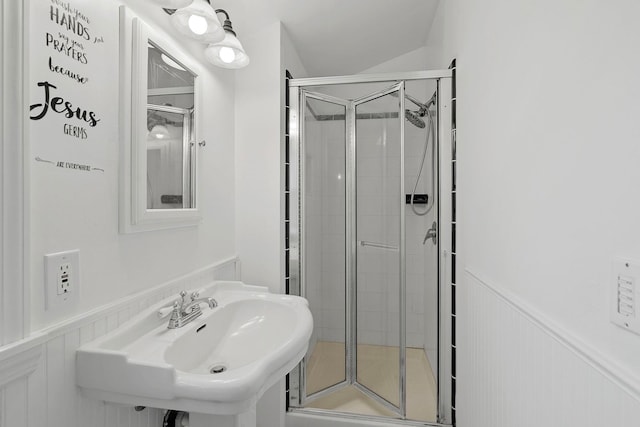 bathroom with sink and an enclosed shower