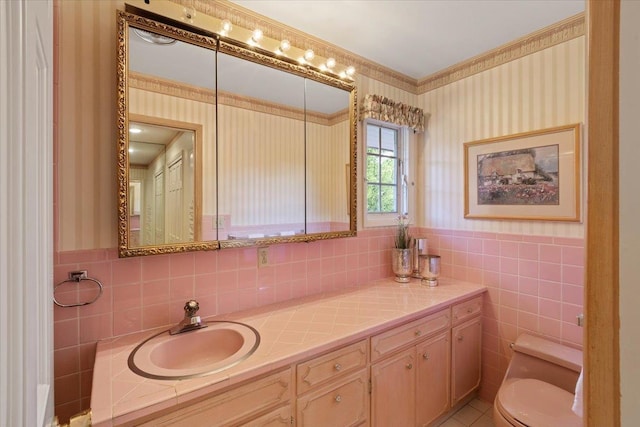 bathroom with vanity, tile patterned floors, and toilet