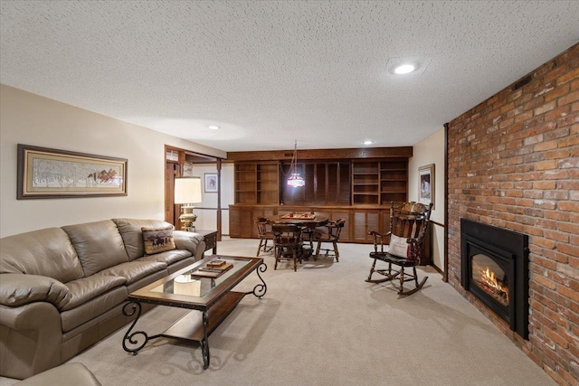 carpeted living room featuring built in features and a textured ceiling