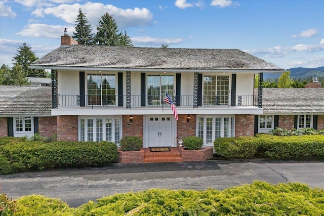 view of front of house with a balcony