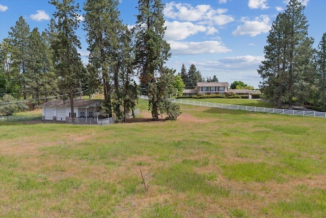 view of yard with a rural view