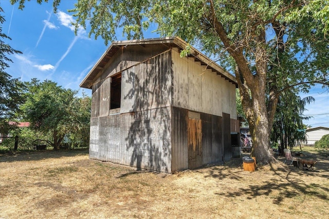 view of home's exterior featuring an outdoor structure