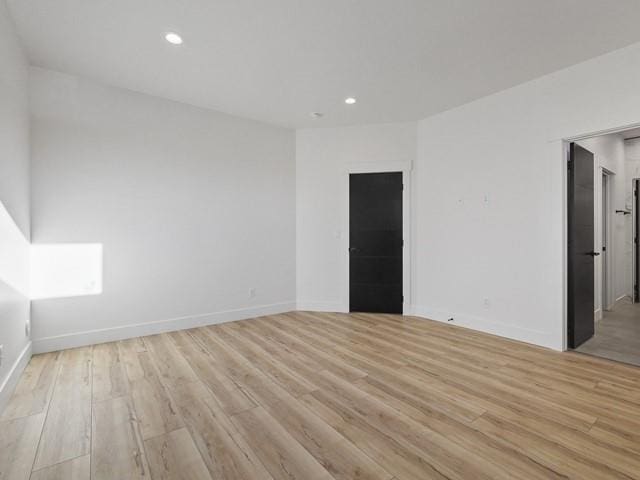 unfurnished room featuring light wood-type flooring