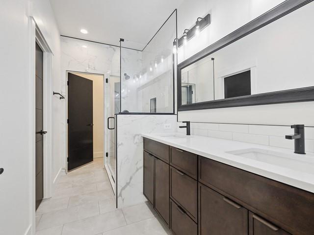 bathroom featuring vanity and walk in shower