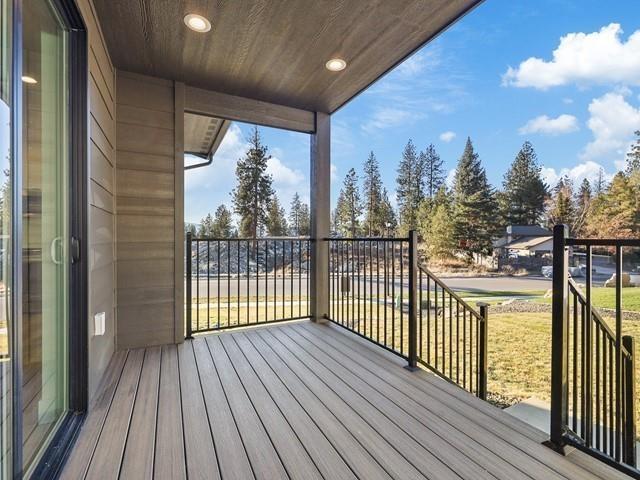 wooden deck with a yard