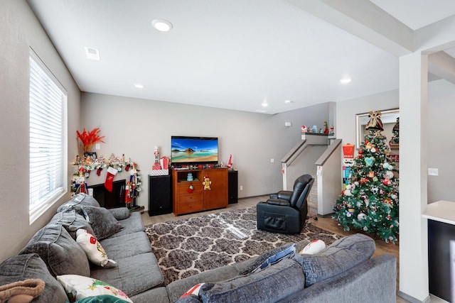 living room featuring plenty of natural light and light hardwood / wood-style floors