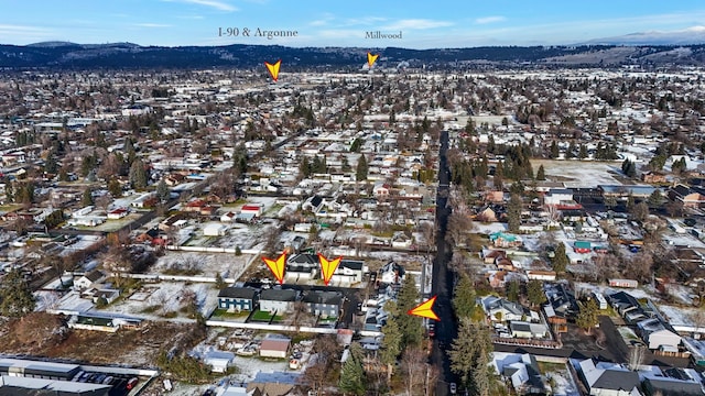 birds eye view of property featuring a mountain view