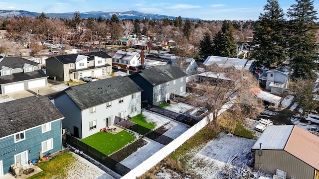 birds eye view of property with a mountain view