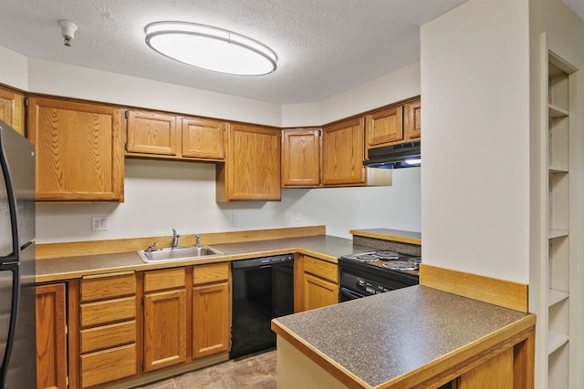 kitchen featuring sink, a textured ceiling, and black appliances