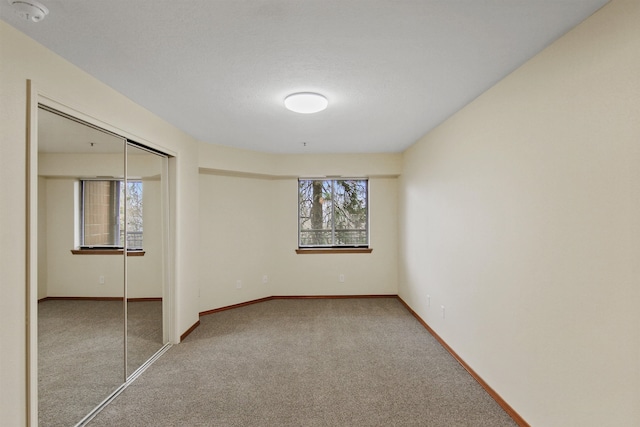 spare room featuring carpet flooring