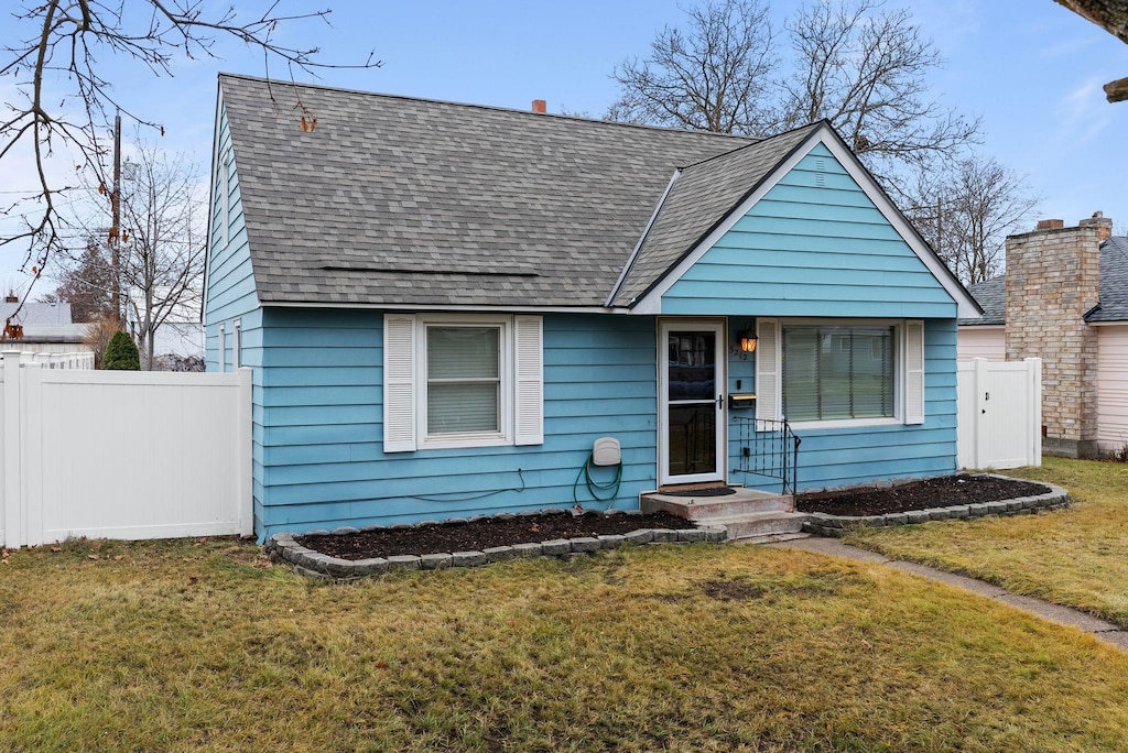 bungalow with a front yard