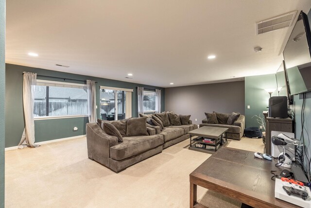 carpeted living room with plenty of natural light