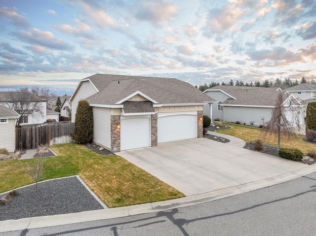 view of front of home featuring a garage and a front lawn