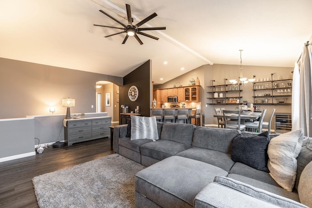 living room featuring vaulted ceiling with beams, ceiling fan with notable chandelier, beverage cooler, and dark hardwood / wood-style floors