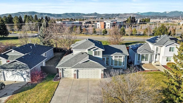 birds eye view of property with a mountain view