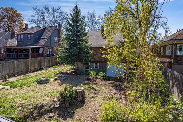 3224 W Cora Ave, Spokane, WA 99205 - view of yard featuring a fenced backyard, an outdoor structure, a patio area, and a shed