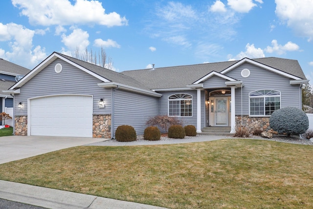 ranch-style home with a garage and a front yard