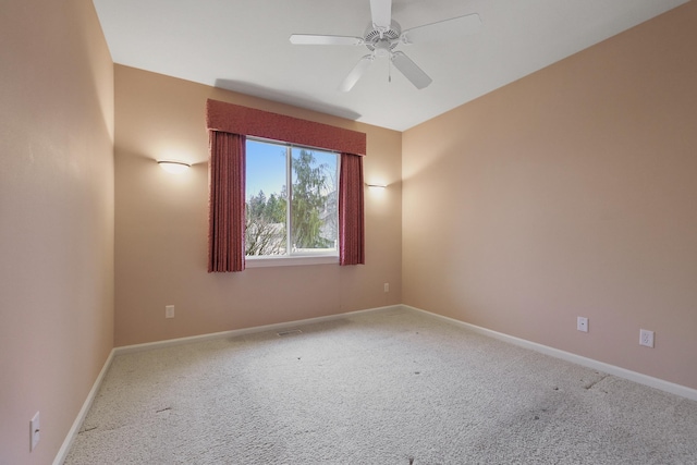 unfurnished room with carpet floors and ceiling fan