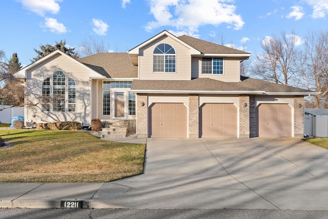 view of front of home with a garage and a front lawn