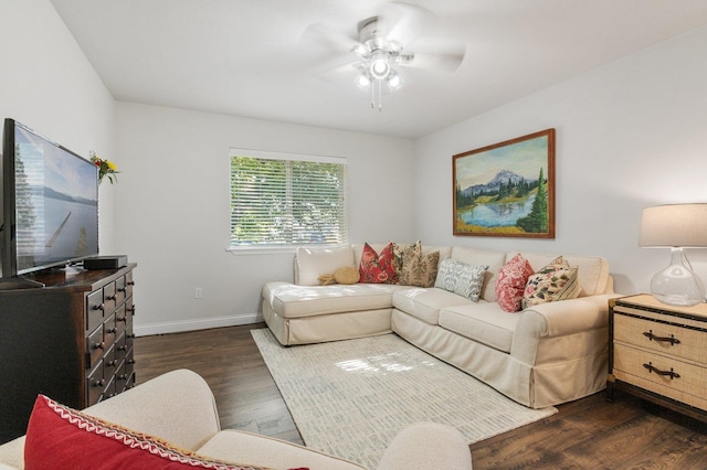 living room with ceiling fan and dark hardwood / wood-style flooring