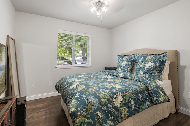 bedroom featuring dark hardwood / wood-style floors and ceiling fan