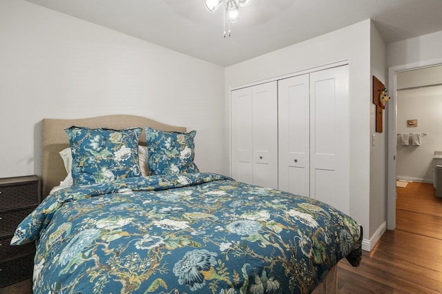 bedroom with dark hardwood / wood-style floors, a closet, and ceiling fan