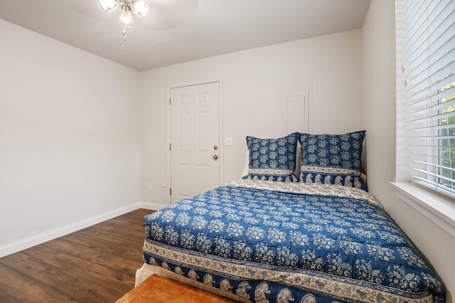 bedroom featuring dark hardwood / wood-style flooring and ceiling fan