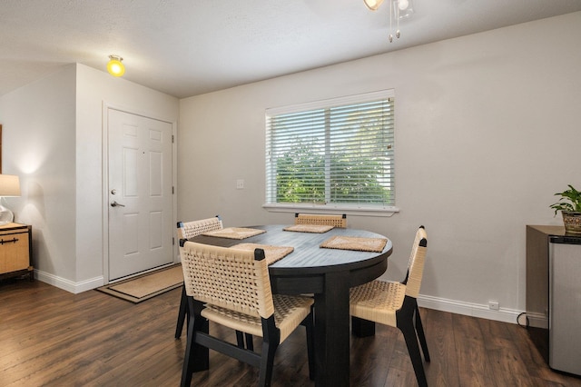 dining room with dark wood-type flooring