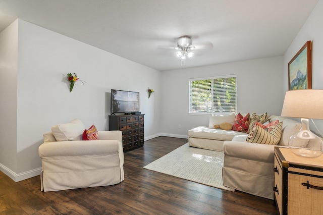 living room with ceiling fan and dark hardwood / wood-style flooring