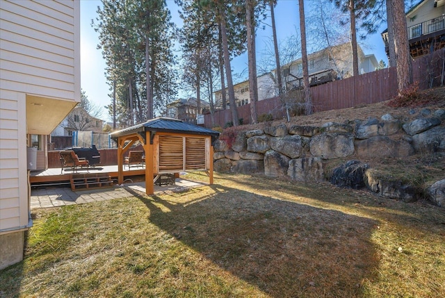 view of yard featuring a gazebo and a deck