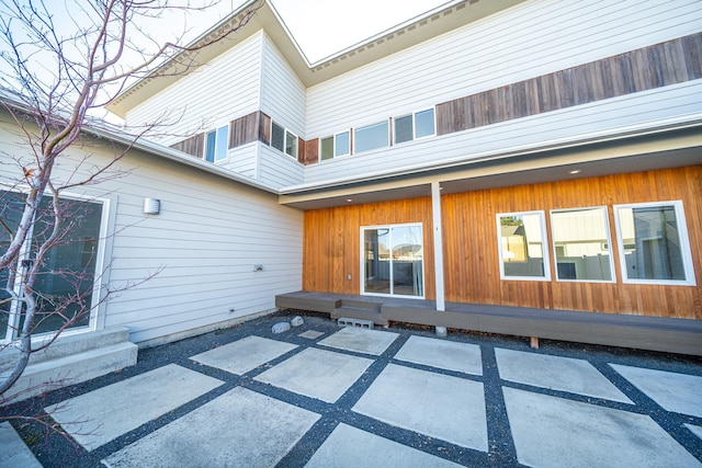 back of property with a patio area