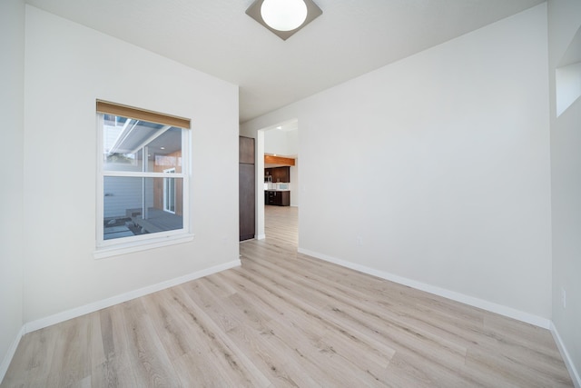 spare room featuring light hardwood / wood-style flooring