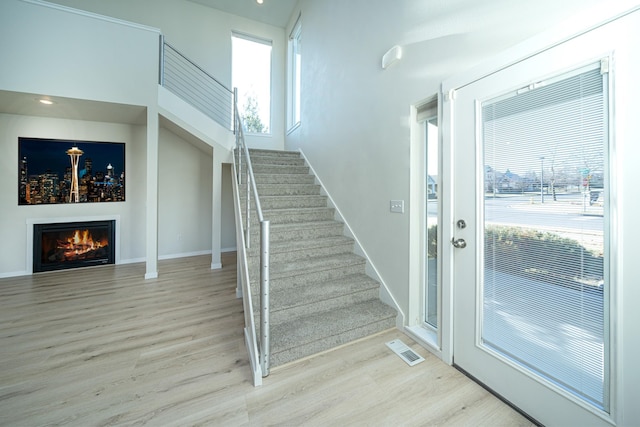 staircase with wood-type flooring