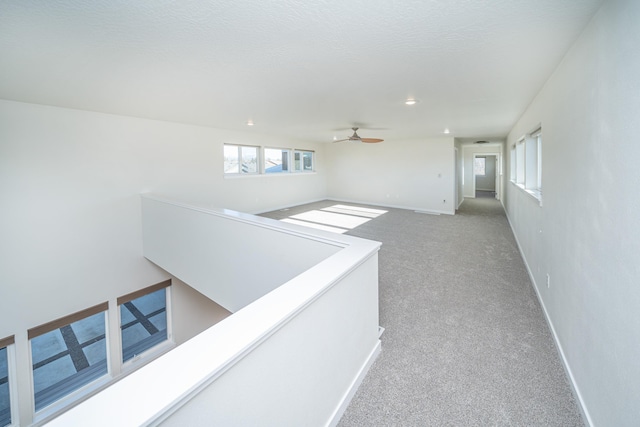 hallway with light carpet