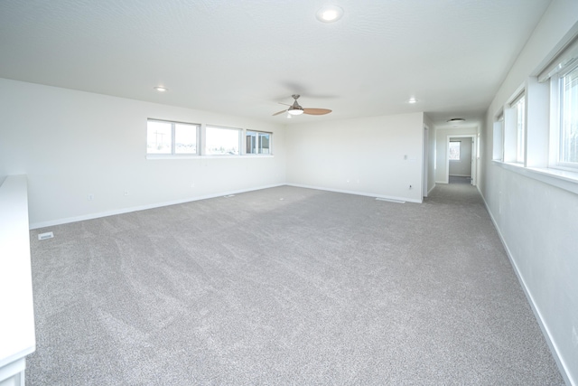 carpeted empty room with ceiling fan