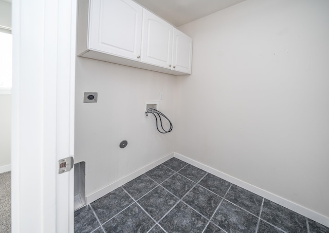 washroom featuring washer hookup, cabinets, and hookup for an electric dryer