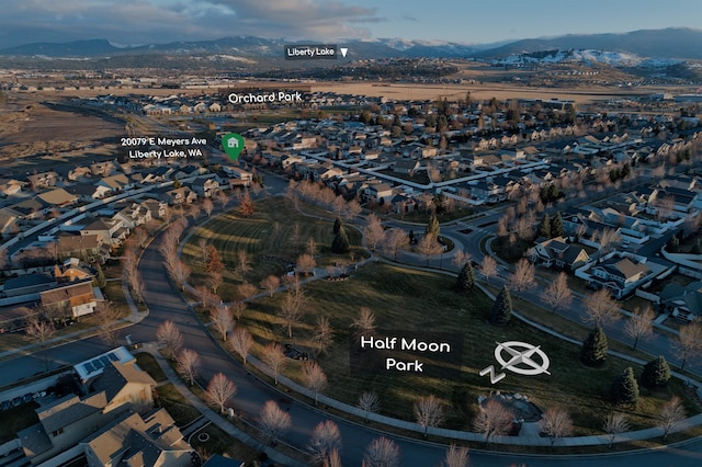 birds eye view of property featuring a mountain view